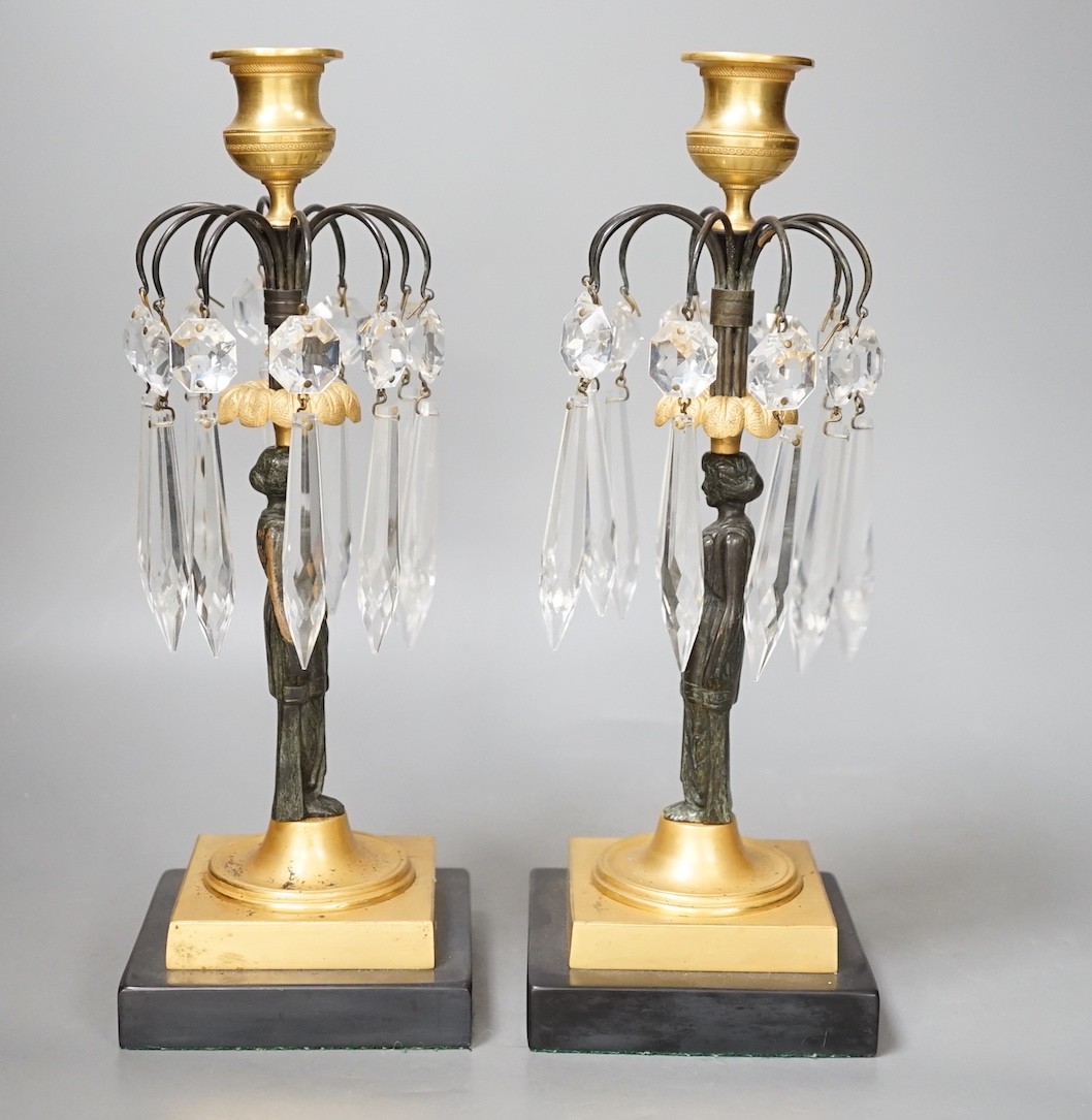 A pair of figural lustre drop candlesticks - 29cm tall